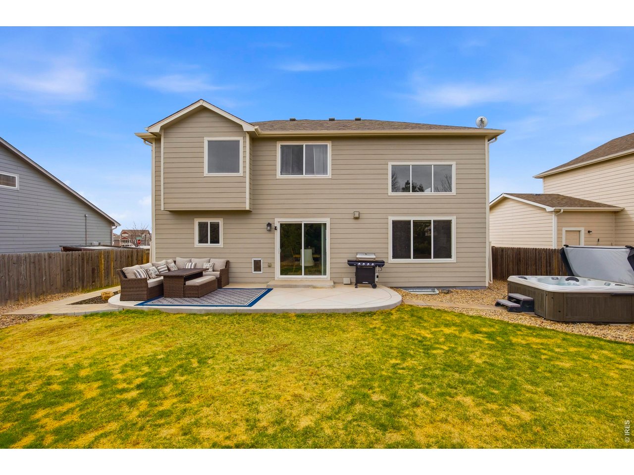 414 Prairie Clover Way Severance, CO 80550 - Photo 42 of 49 a view of swimming pool with outdoor seating and house in the background