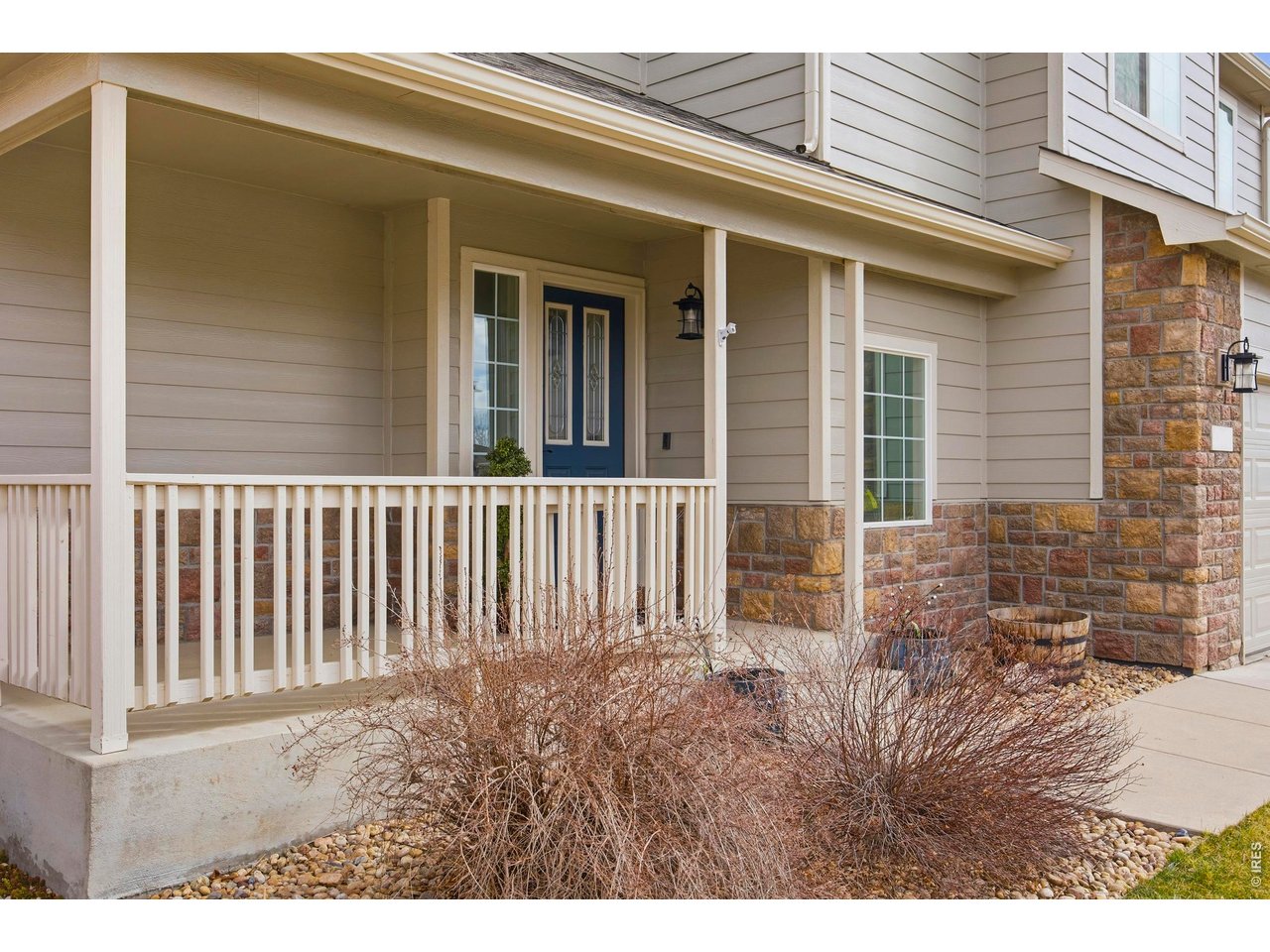 414 Prairie Clover Way Severance, CO 80550 - Photo 5 of 49 a view of a house with a small yard and wooden floor and fence