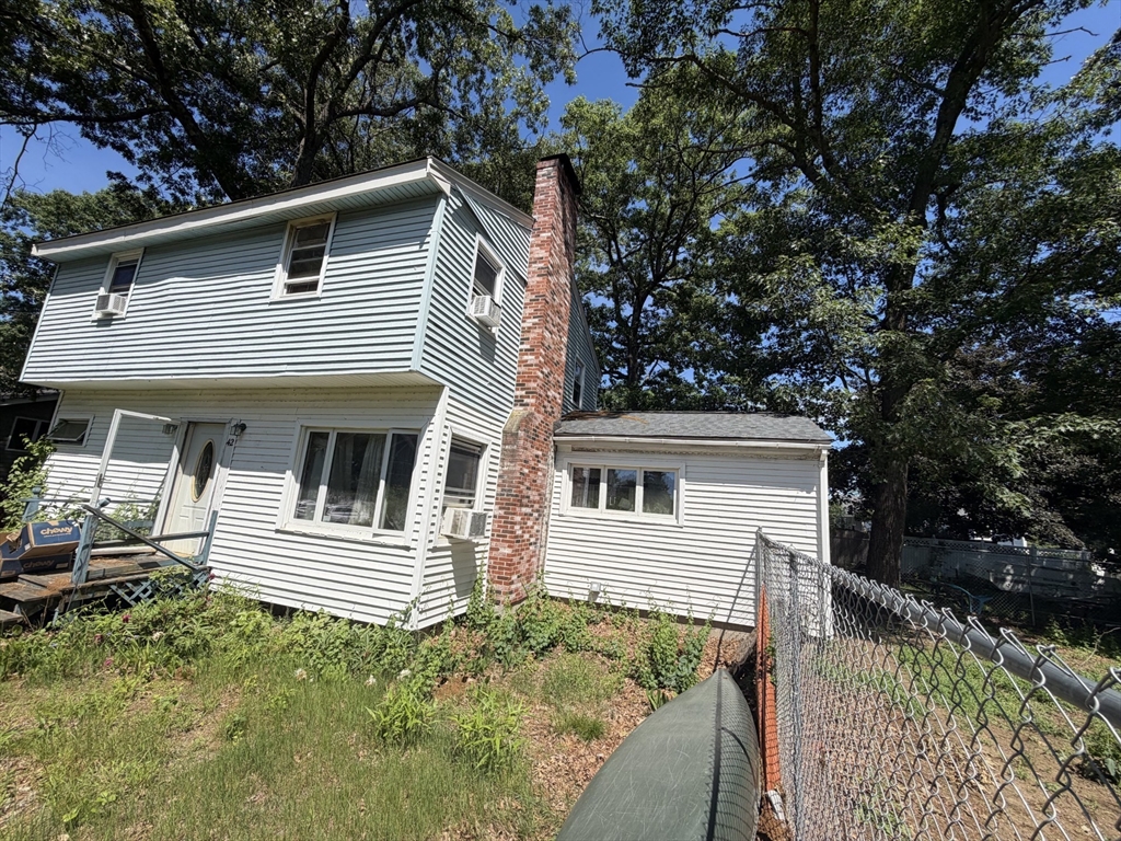 a view of house with trees in the background