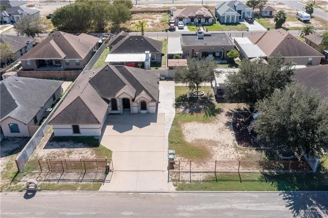 an aerial view of a house with a garden