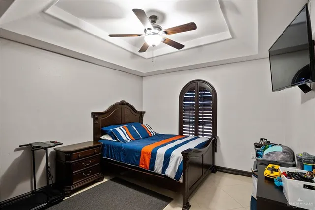 a bedroom with furniture and a window