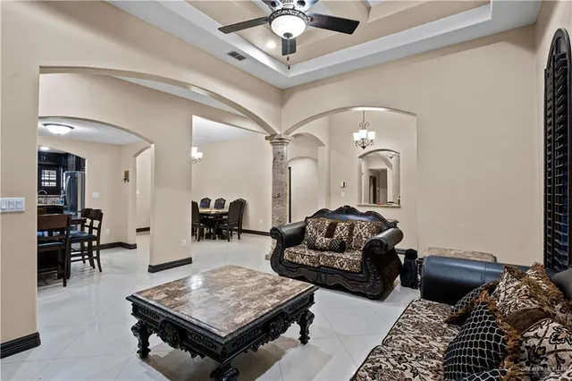 a living room with furniture and a rug