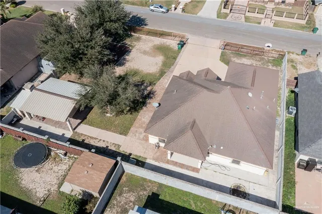 an aerial view of a house with outdoor space