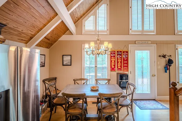 a view of a dining room with furniture and window