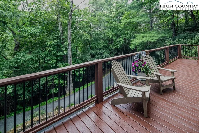 a view of a two chairs in the balcony