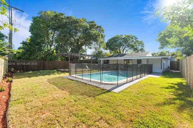a view of a swimming pool with a patio