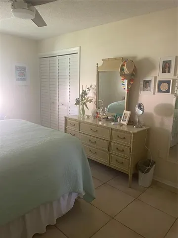 a bedroom with a bed and a cabinets