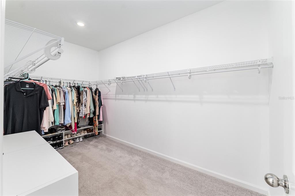 19692 Southwest 77th Loop Dunnellon, FL 34432 - Photo 13 of 20 a view of a room with clothes and shoes