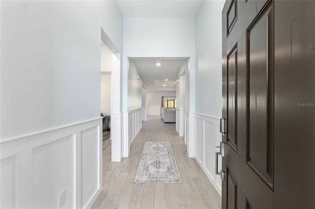 19692 Southwest 77th Loop Dunnellon, FL 34432 - Photo 3 of 20 a view of a hallway with wooden floor