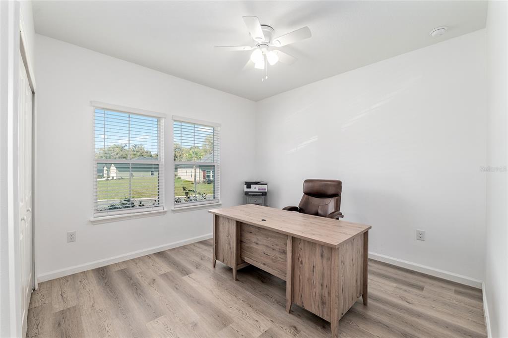 19692 Southwest 77th Loop Dunnellon, FL 34432 - Photo 4 of 20 a view of a workspace with furniture and a window
