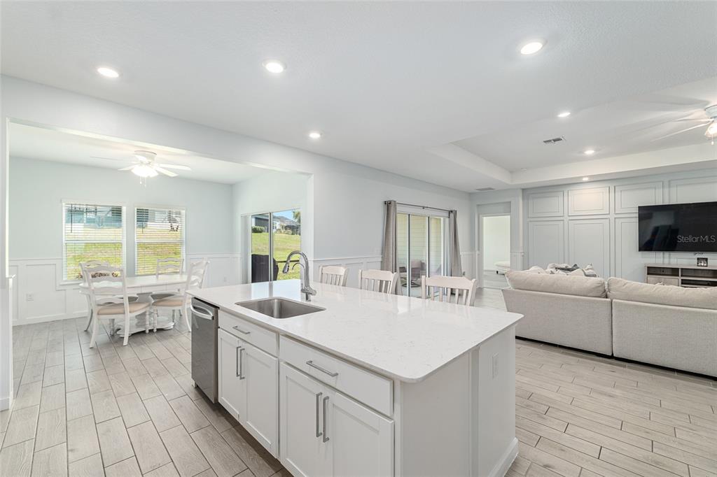 19692 Southwest 77th Loop Dunnellon, FL 34432 - Photo 10 of 20 a large white kitchen with a large window