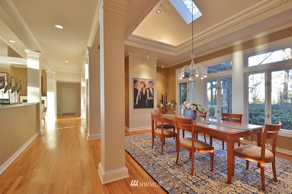 7120 Maxwelton Road Clinton, WA 98236 - Photo 13 of 25 a view of a dining room with furniture and wooden floor