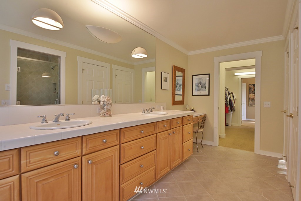 7120 Maxwelton Road Clinton, WA 98236 - Photo 17 of 25 a spacious bathroom with a double vanity sink double and mirror