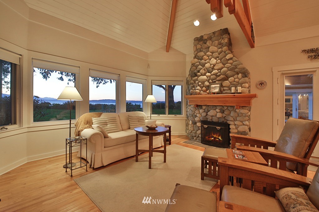 7120 Maxwelton Road Clinton, WA 98236 - Photo 21 of 25 a living room with furniture and a fireplace