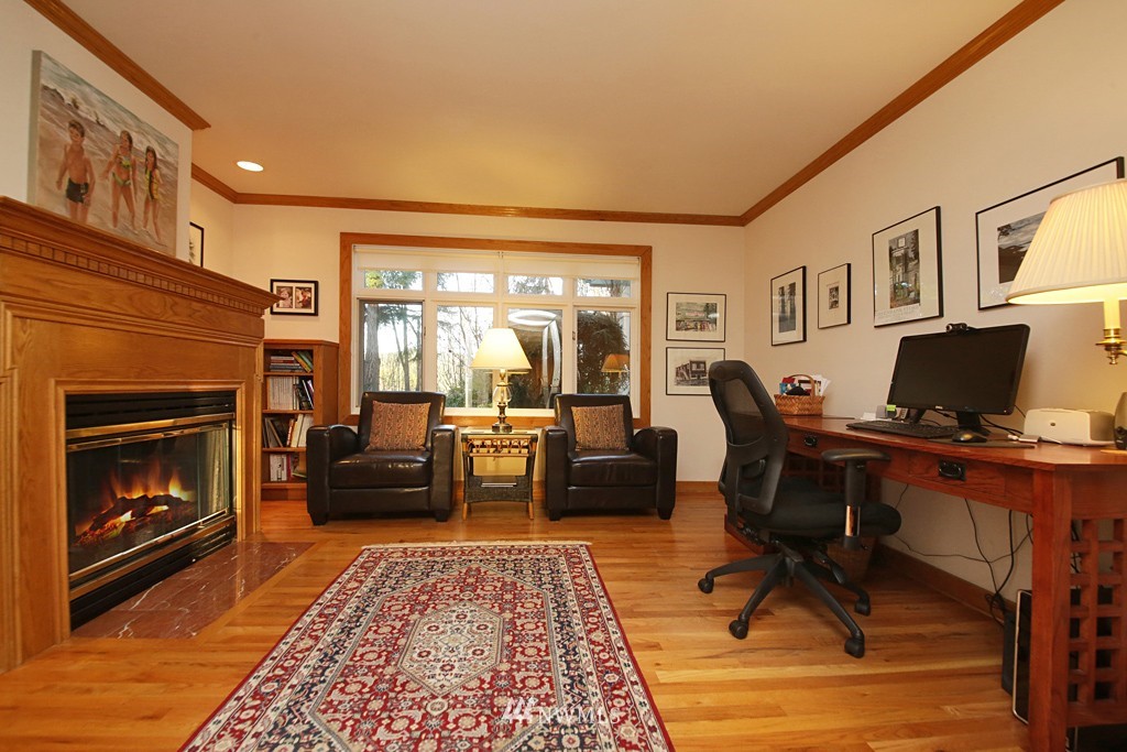 7120 Maxwelton Road Clinton, WA 98236 - Photo 22 of 25 a living room with furniture rug and a fireplace