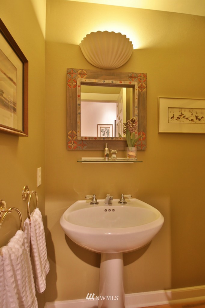 7120 Maxwelton Road Clinton, WA 98236 - Photo 25 of 25 a bathroom with a sink and a mirror