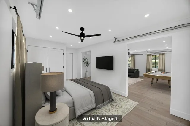 an aerial view of residential houses with outdoor space