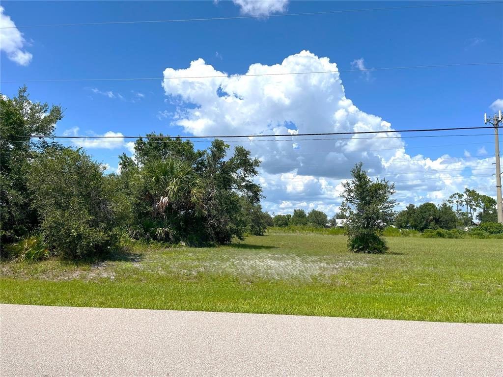1394 Saxony Circle Punta Gorda, FL 33983 - Photo 12 of 13 a view of a golf course with a big yard
