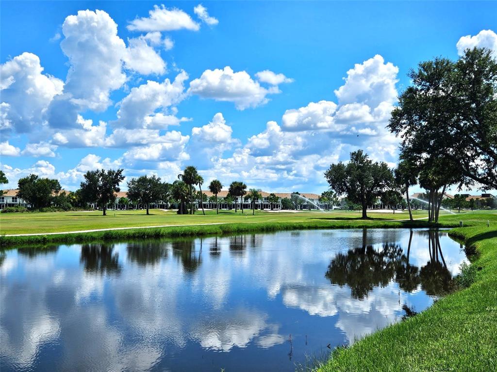 1394 Saxony Circle Punta Gorda, FL 33983 - Photo 2 of 13 a view of a lake with houses