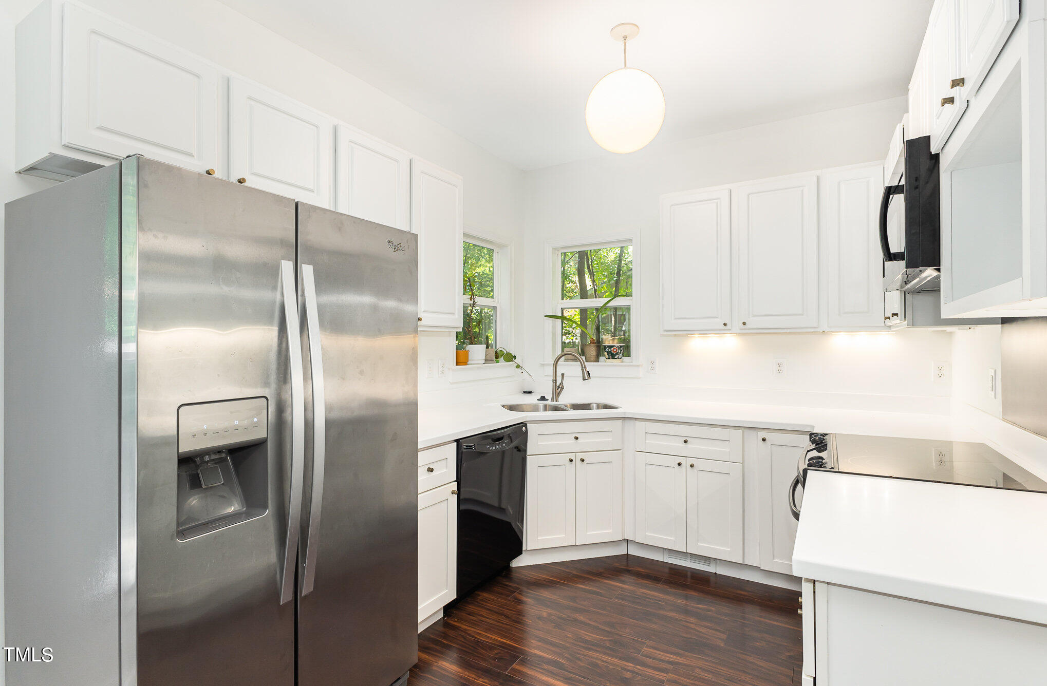 1713 Evergreen Avenue Raleigh, NC 27603 - Photo 11 of 26 a kitchen with a refrigerator sink and cabinets