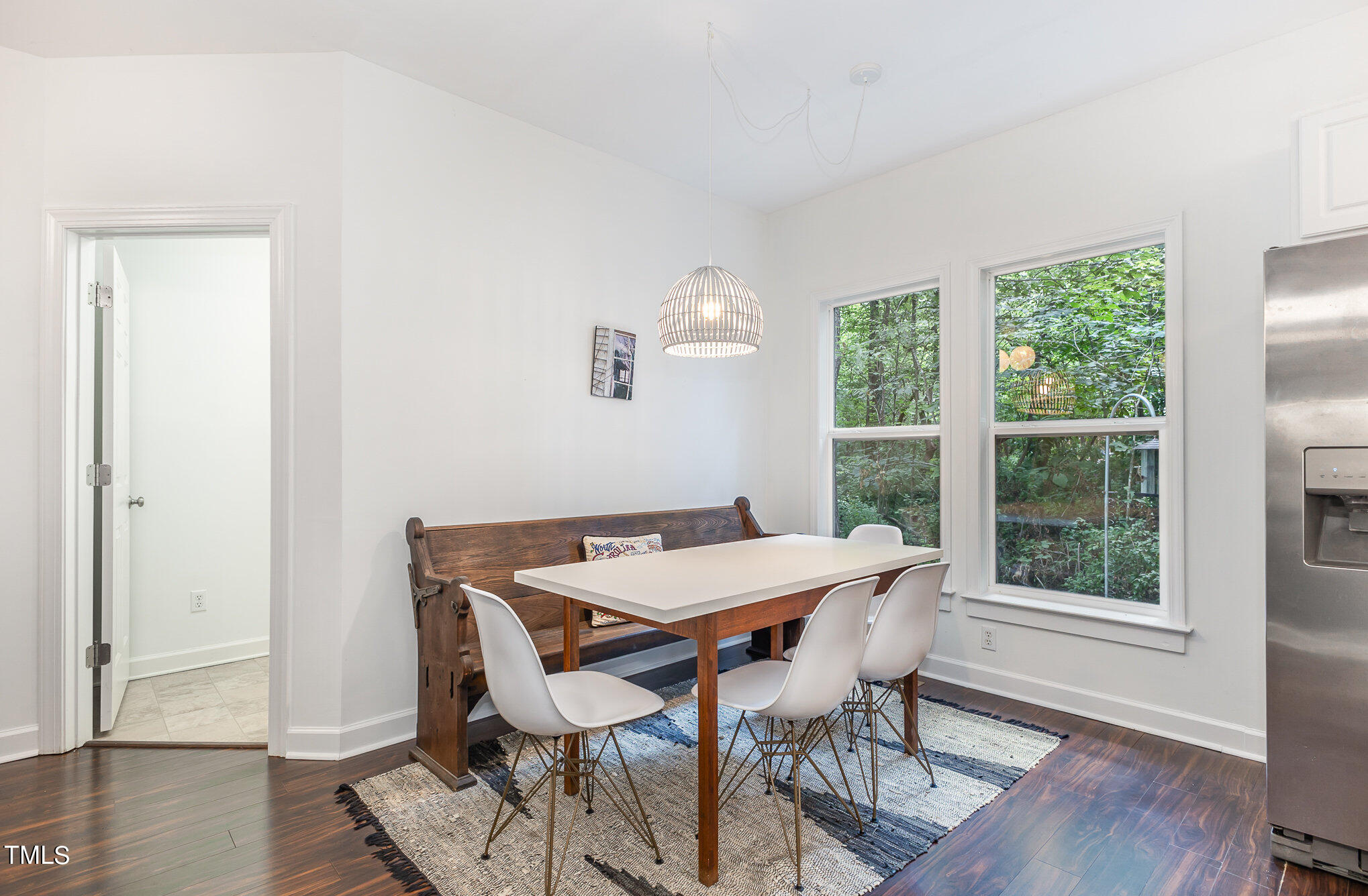 1713 Evergreen Avenue Raleigh, NC 27603 - Photo 12 of 26 a view of a dining room with furniture window and wooden floor
