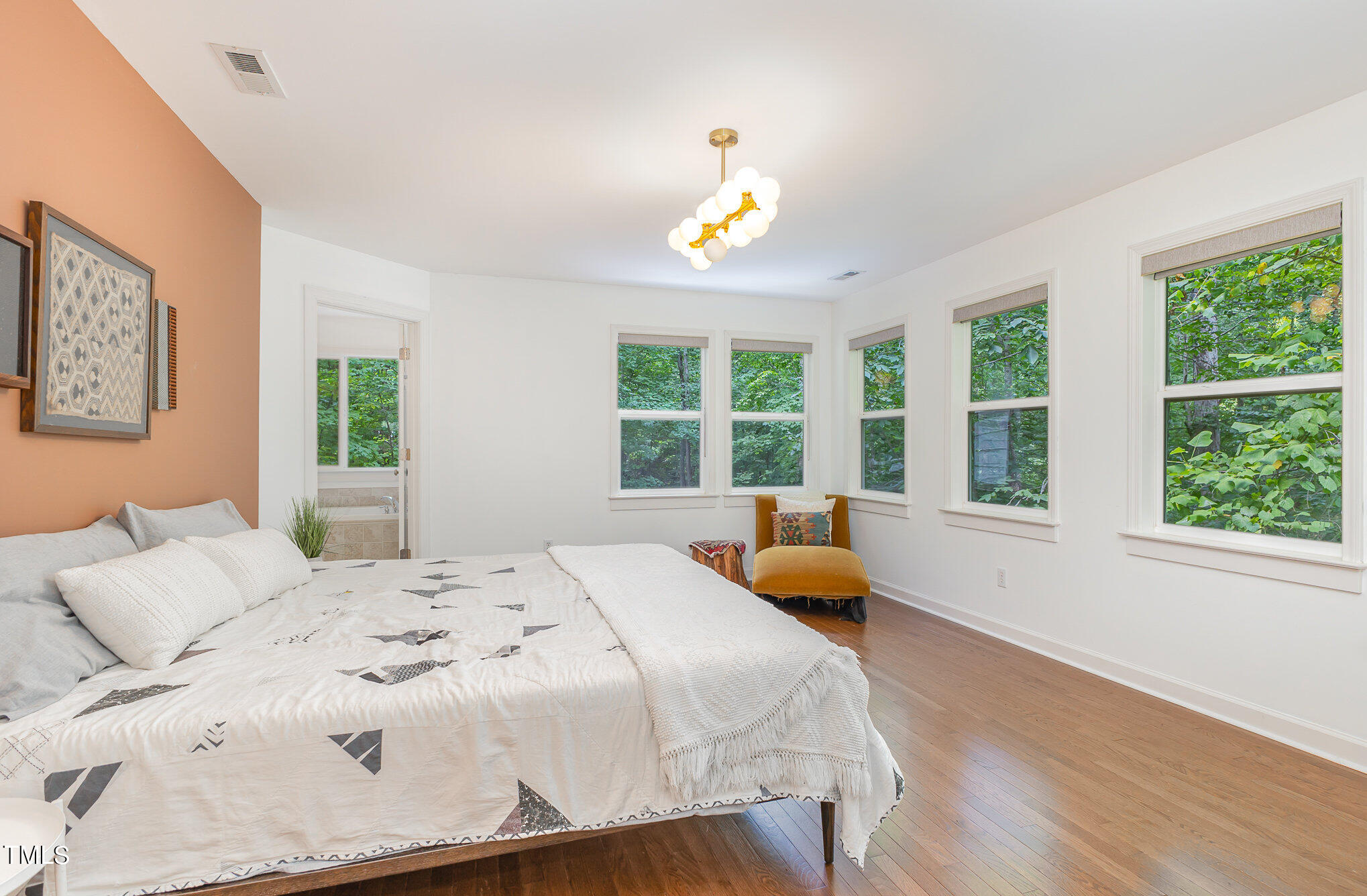 1713 Evergreen Avenue Raleigh, NC 27603 - Photo 15 of 26 a bedroom with a bed and a window