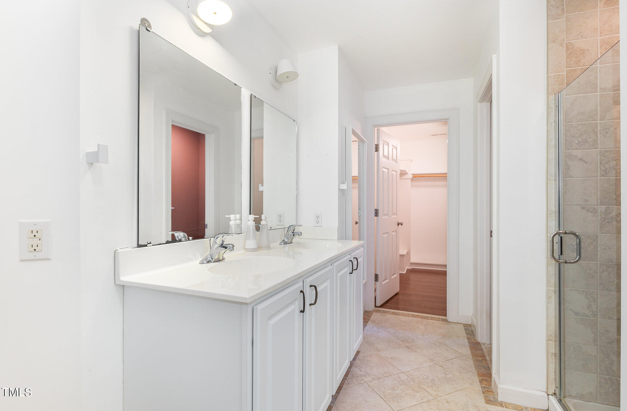 1713 Evergreen Avenue Raleigh, NC 27603 - Photo 17 of 26 a view of a bathroom with a sink and mirror