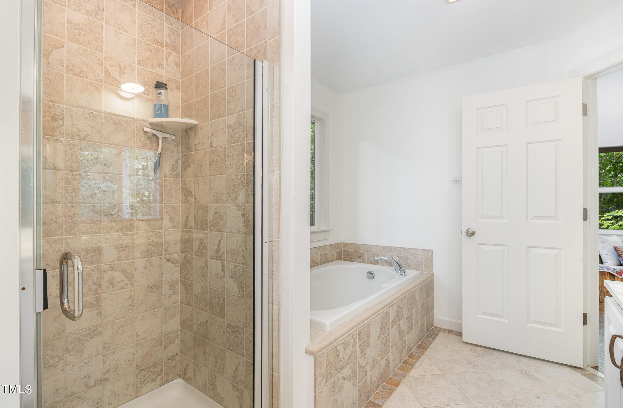 1713 Evergreen Avenue Raleigh, NC 27603 - Photo 18 of 26 a bathroom with a bathtub and shower