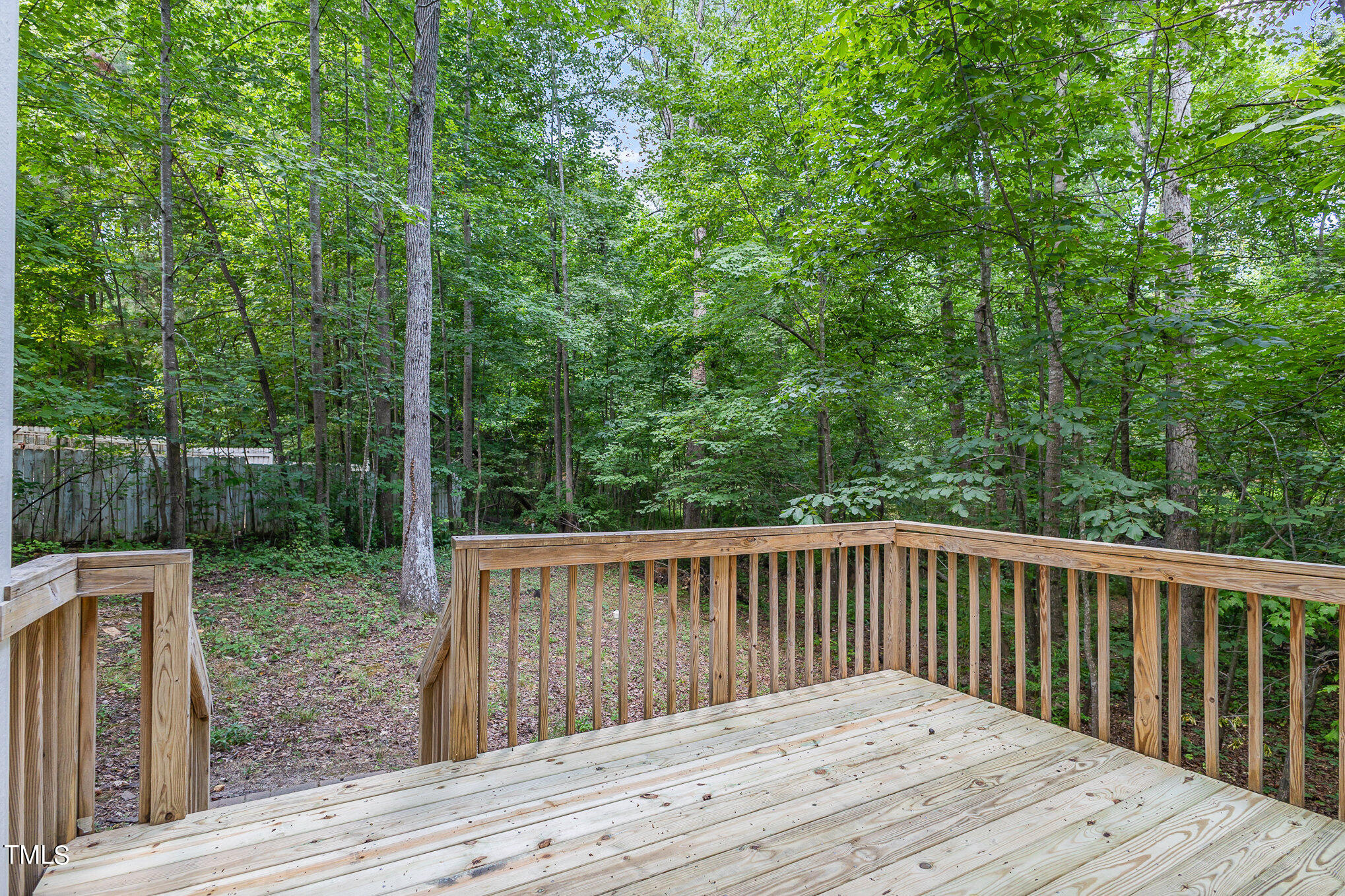 1713 Evergreen Avenue Raleigh, NC 27603 - Photo 24 of 26 a balcony view with wooden floor and fence