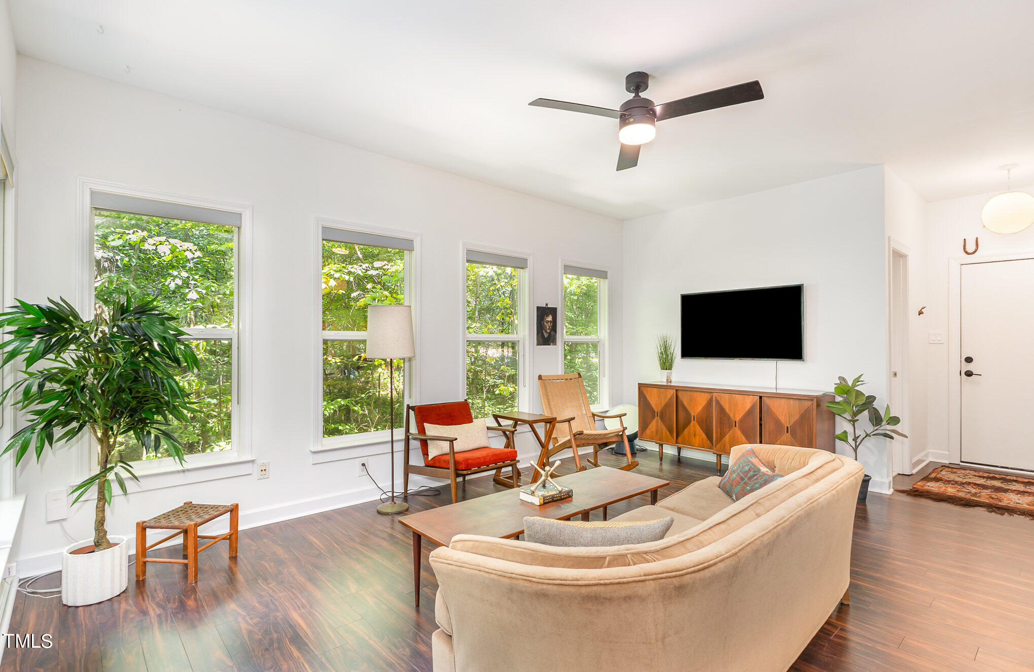 1713 Evergreen Avenue Raleigh, NC 27603 - Photo 6 of 26 a living room with furniture and a large window