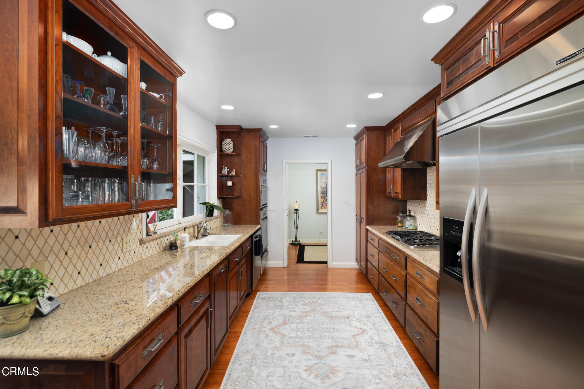 1825 Elevado Avenue Arcadia, CA 91006 - Photo 31 of 63 a large kitchen with stainless steel appliances granite countertop a large counter top a stove and a refrigerator