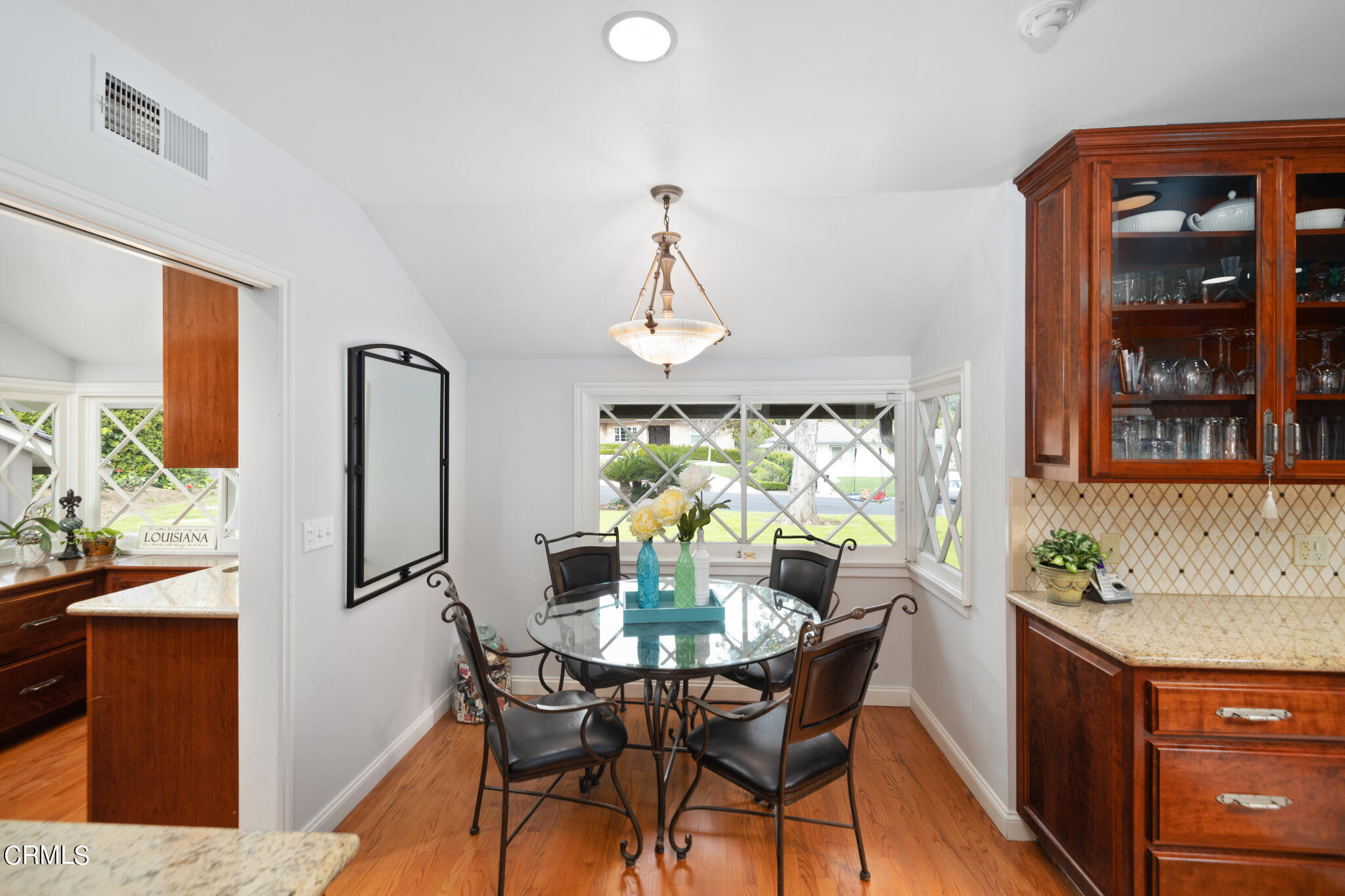 1825 Elevado Avenue Arcadia, CA 91006 - Photo 34 of 63 a dining room with furniture a window and a chandelier