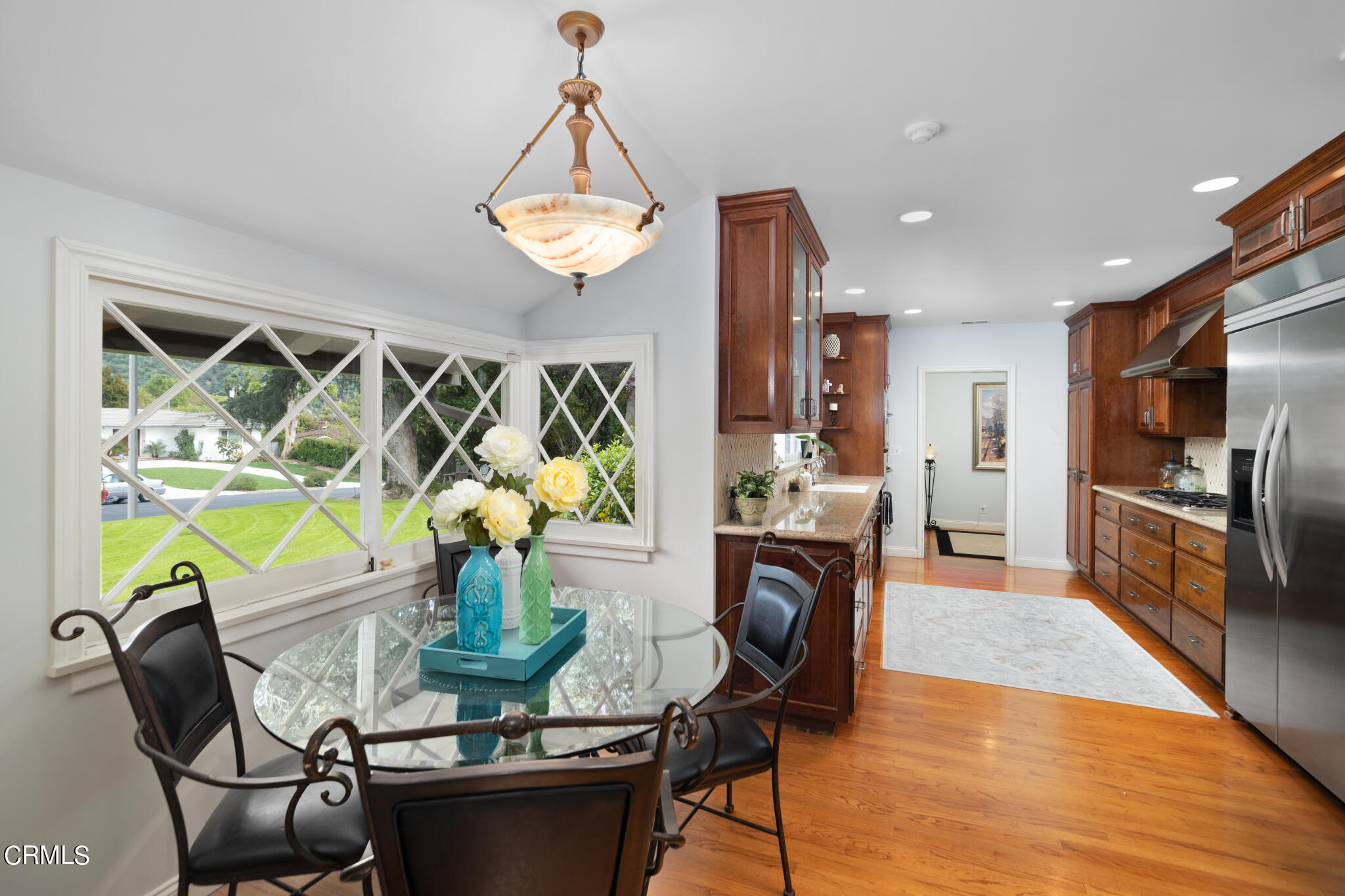 1825 Elevado Avenue Arcadia, CA 91006 - Photo 35 of 63 a view of a dining room with furniture a chandelier and wooden floor
