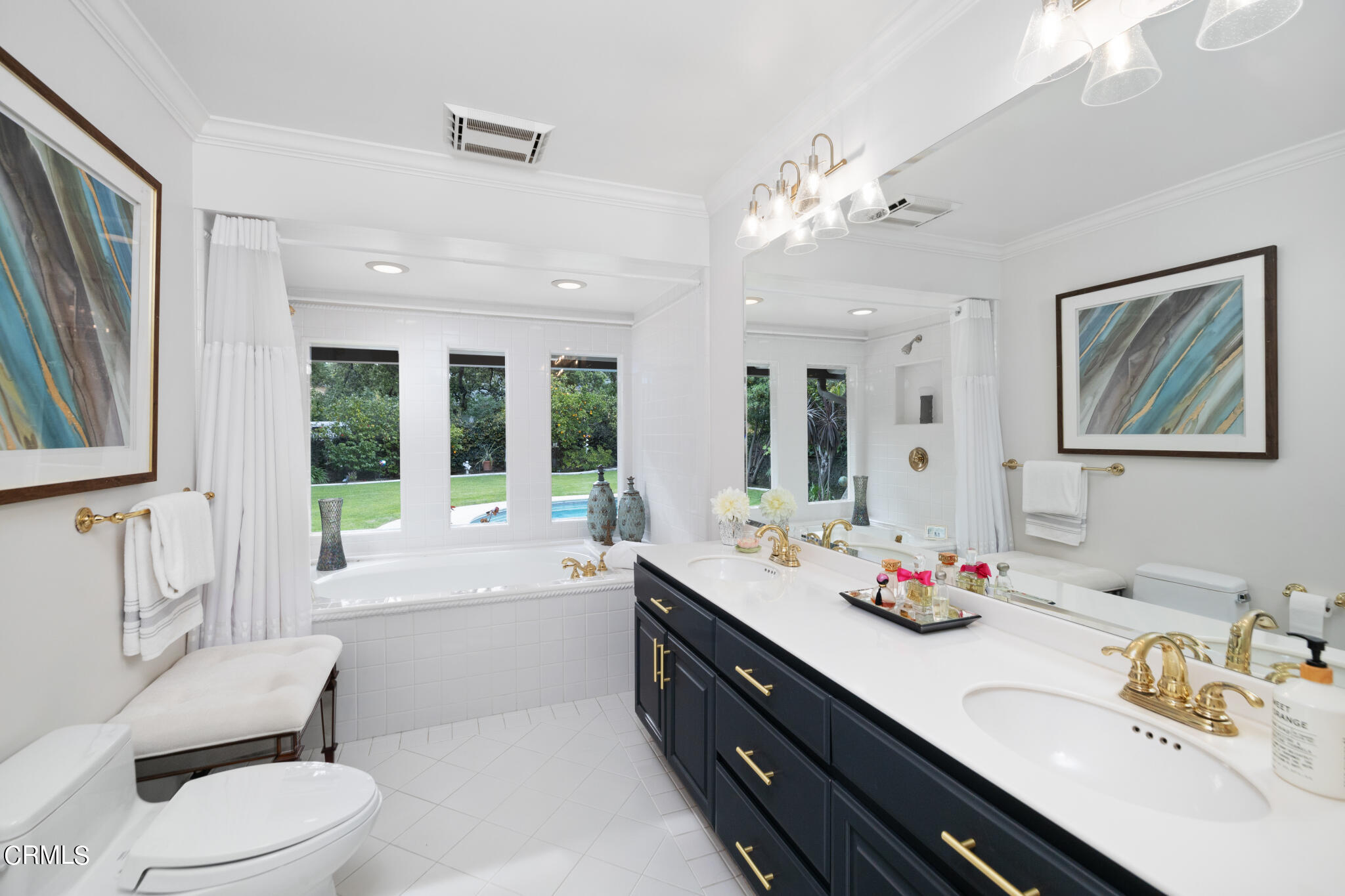 1825 Elevado Avenue Arcadia, CA 91006 - Photo 40 of 63 a spacious bathroom with a granite countertop sink a toilet a large mirror and vanity