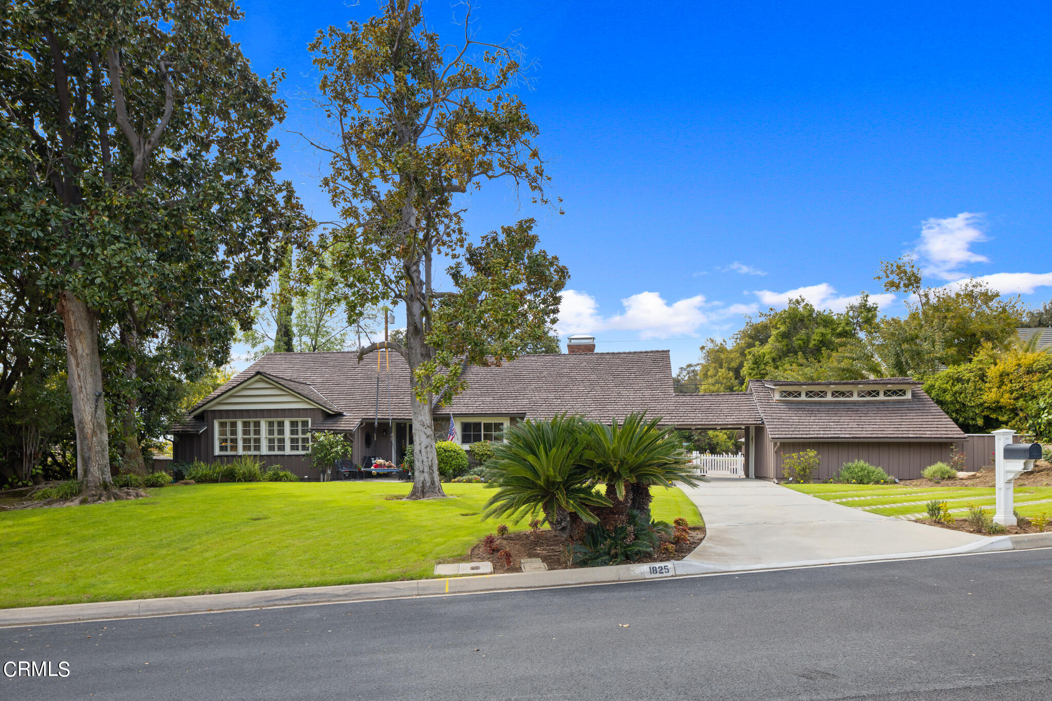 1825 Elevado Avenue Arcadia, CA 91006 - Photo 9 of 63 a front view of a house with a yard and a garage