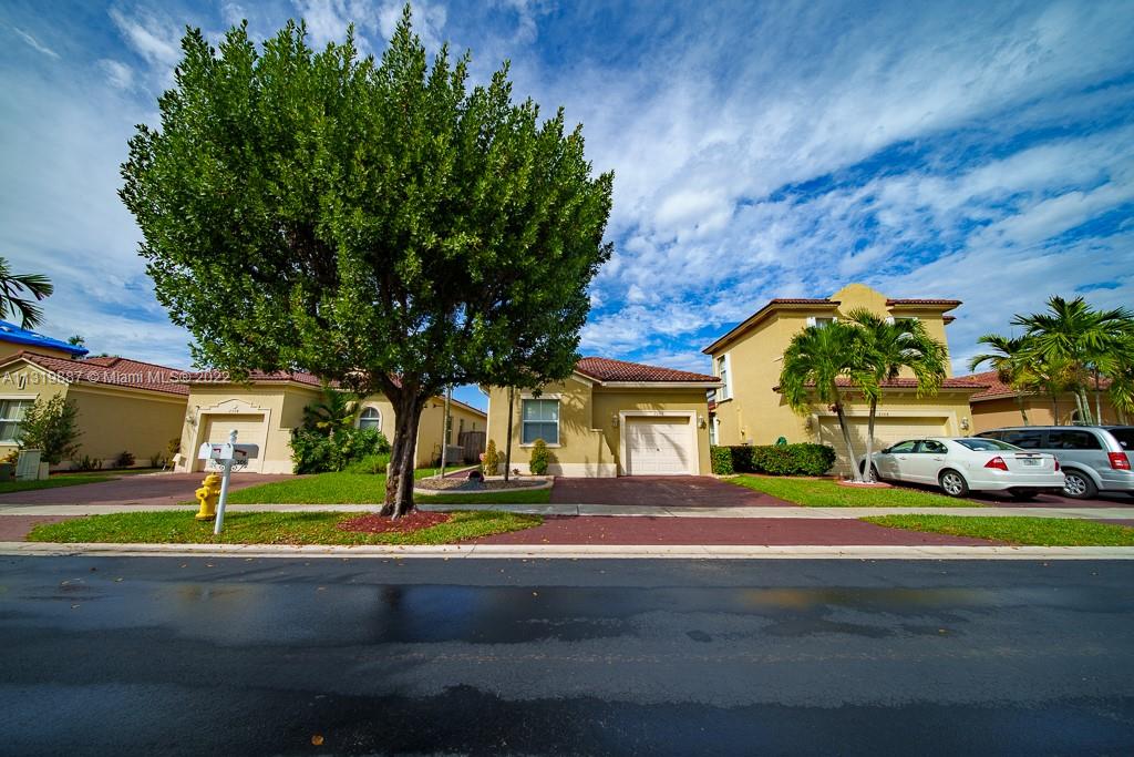2306 Northeast 37th Road Homestead, FL 33033 - Photo 1 of 17 a view of street with parked cars
