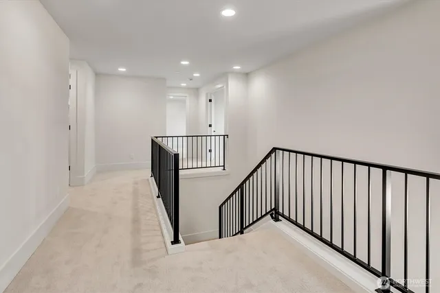 a view of a hallway with staircase