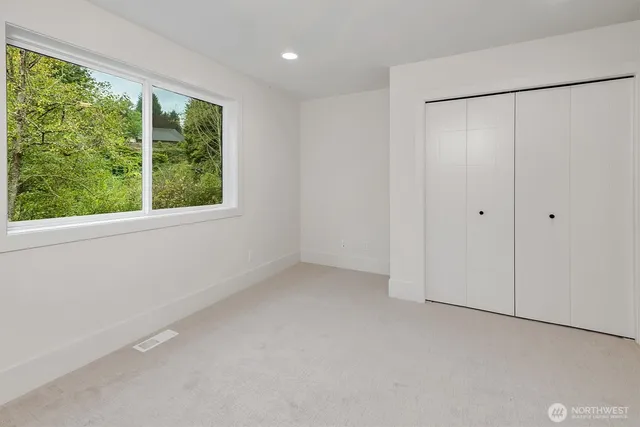 a view of a room with a large window