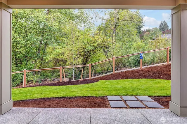 a view of a backyard with sitting area