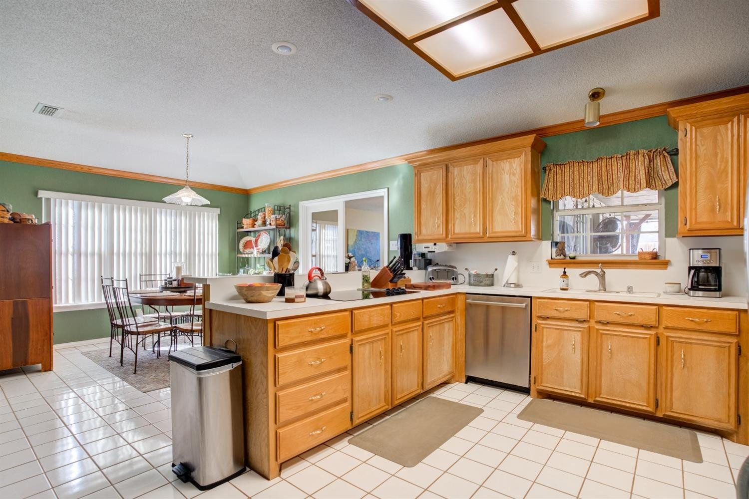 6022 78th Street Lubbock, TX 79424 - Photo 13 of 43 a kitchen with sink cabinets and window