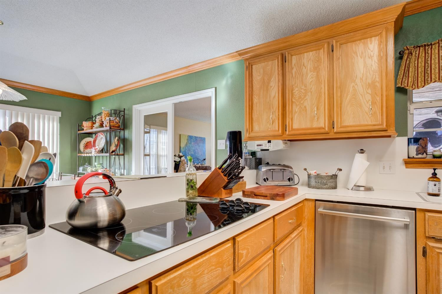 6022 78th Street Lubbock, TX 79424 - Photo 15 of 43 a kitchen with a sink stove and cabinets