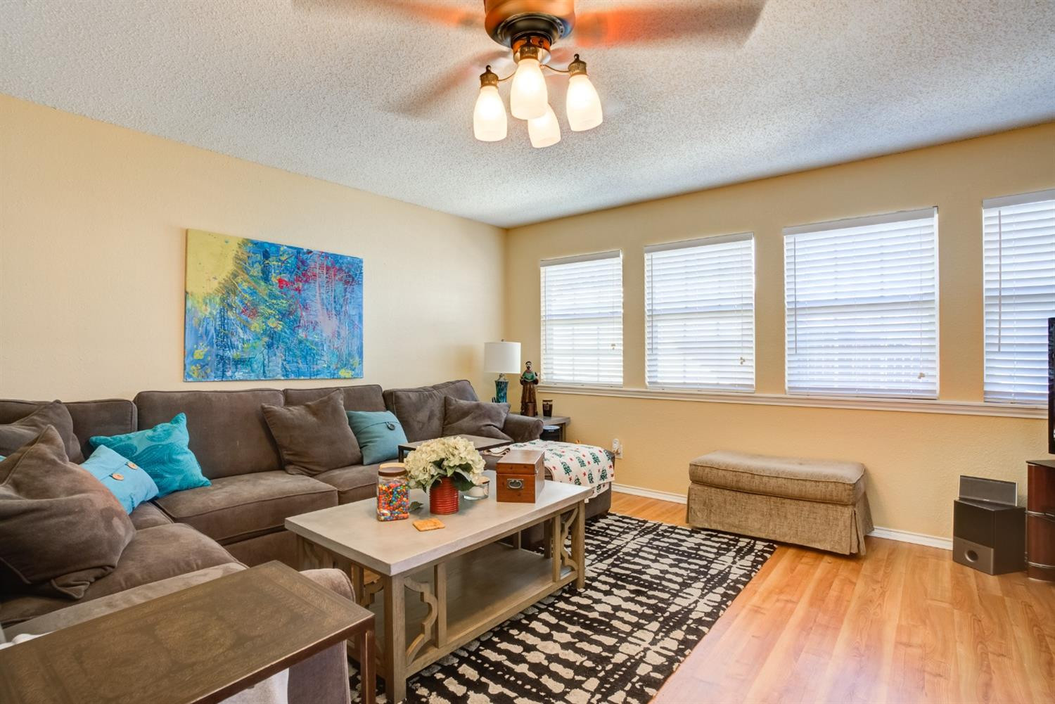 6022 78th Street Lubbock, TX 79424 - Photo 23 of 43 a living room with furniture and a chandelier
