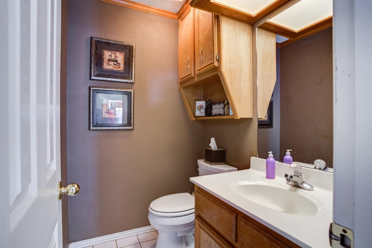 6022 78th Street Lubbock, TX 79424 - Photo 26 of 43 a bathroom with a sink mirror vanity and toilet