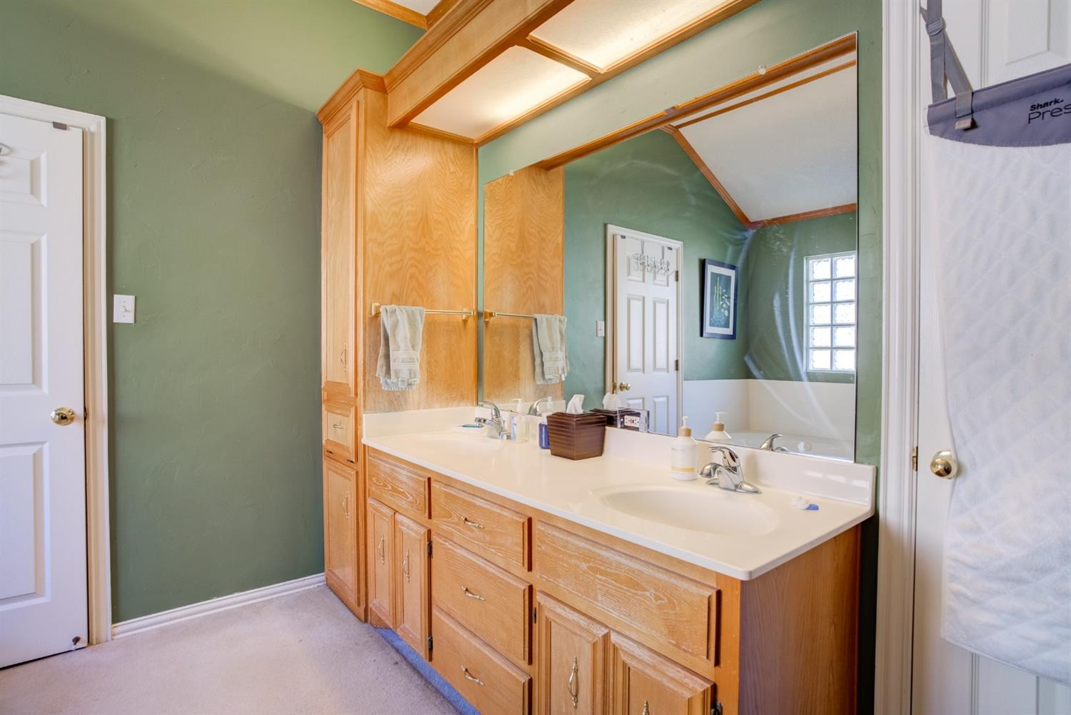 6022 78th Street Lubbock, TX 79424 - Photo 34 of 43 a bathroom with 2 sink and a mirror