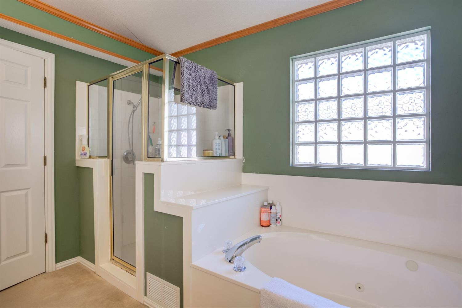 6022 78th Street Lubbock, TX 79424 - Photo 36 of 43 a bathroom with a bathtub and a shower