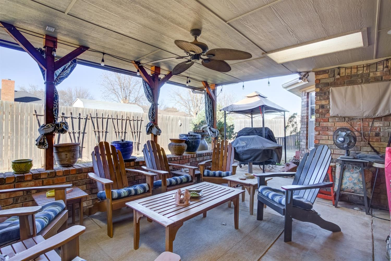 6022 78th Street Lubbock, TX 79424 - Photo 39 of 43 a view of a patio with a table and chairs