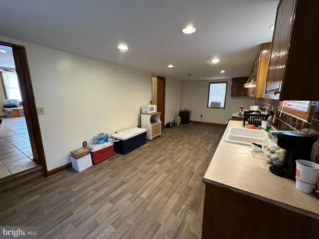 a view of a livingroom with furniture and a window