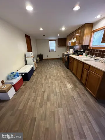 a view of staircase with a rug and a window