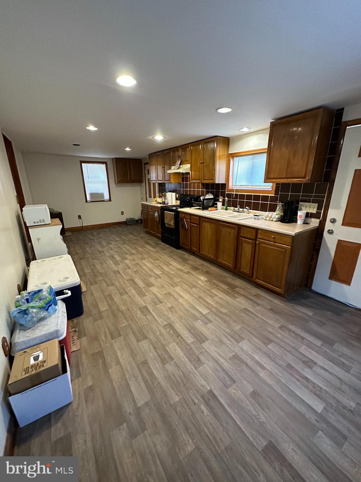39 Yorke Street Salem, NJ 08079 - Photo 15 of 88 a kitchen with stainless steel appliances granite countertop a stove and a wooden floors