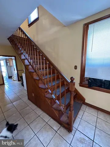 a bathroom with a shower and a mirror